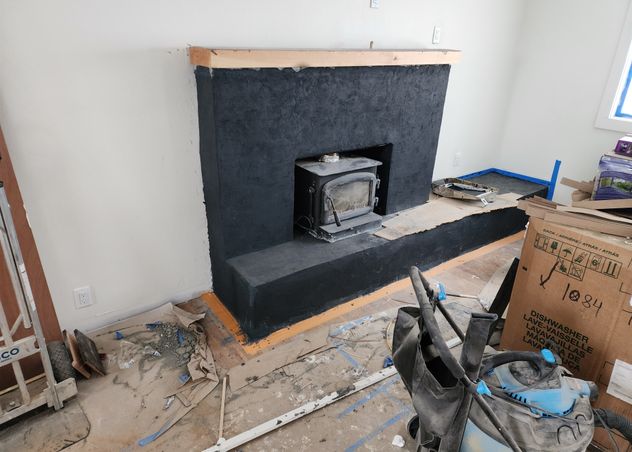 Stucco Fireplace for and overhaul of brick and mortar built by Hutch Construction