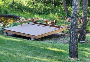 Deck by a pond in Jackson Creek built by Hutch Construction
