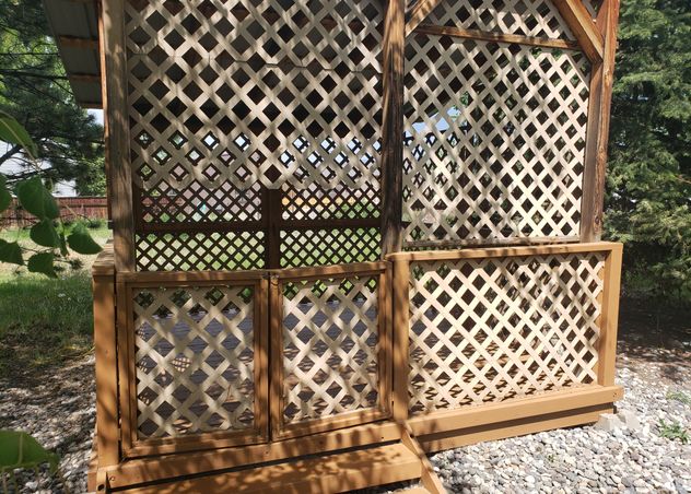 Gazebo stained and refinished by Hutch Construction in Belgrade Mt