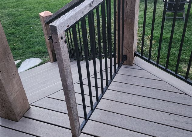 Deck gate built with refurbished wood and new metal railings via Hutch Construction.